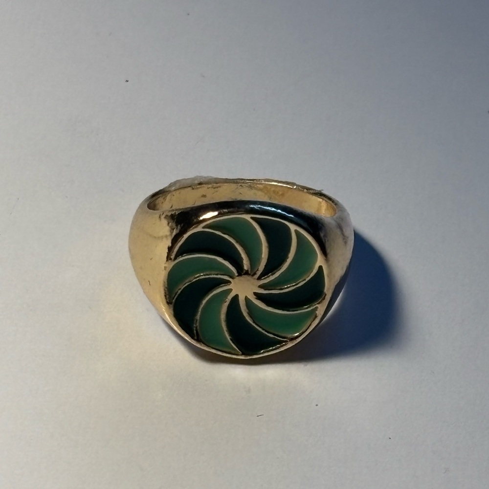 Gold Ring with Green Swirl Design